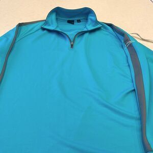 Dunning golf men’s large pull over color is turquoise with a gray stripe.